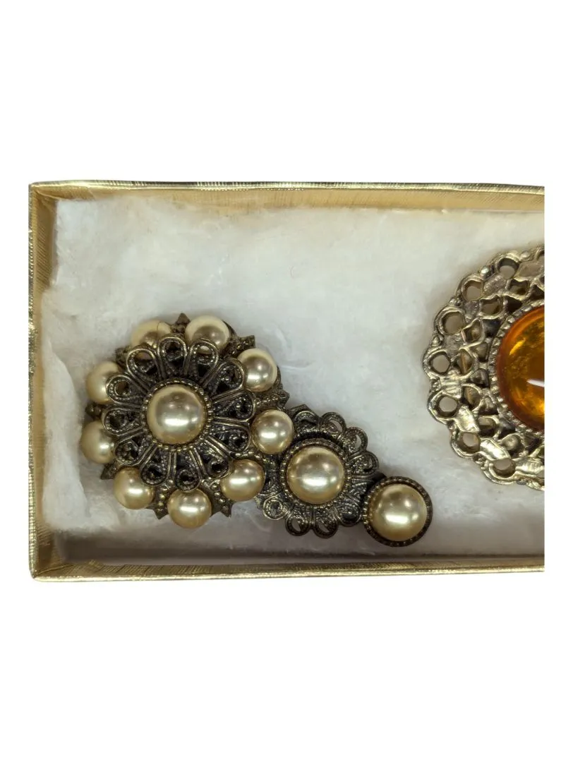 Assorted honey-tone brooches